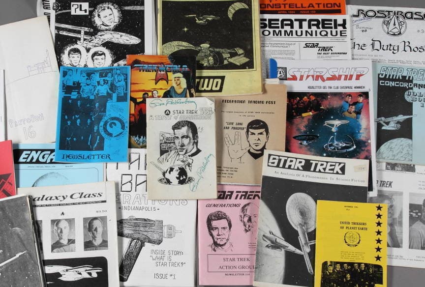 A stack of Star Trelk fanzines from through the years.