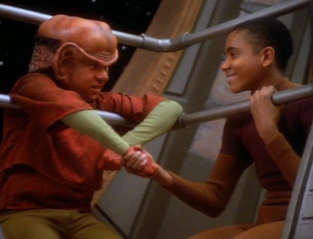 Young Nog the Ferengi and Jake Sisko share a playful moment together on Deep Space Nine, showing their unlikely friendship