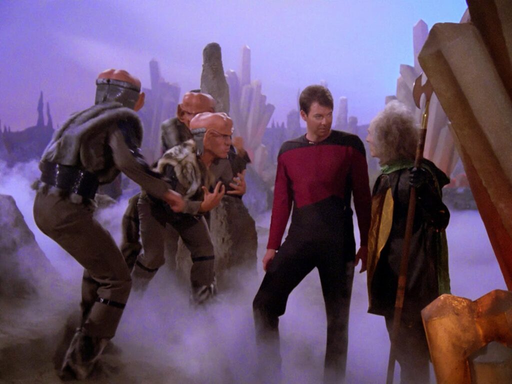 Ferengi soldiers grab a Starfleet officer on a foggy alien planet in the TNG episode The Last Outpost, the first appearance of the Ferengi species