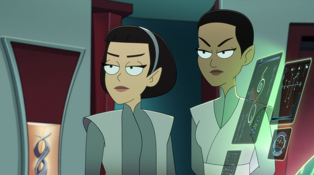 Two animated Vulcan women stand inside a starship, both wearing serious expressions.