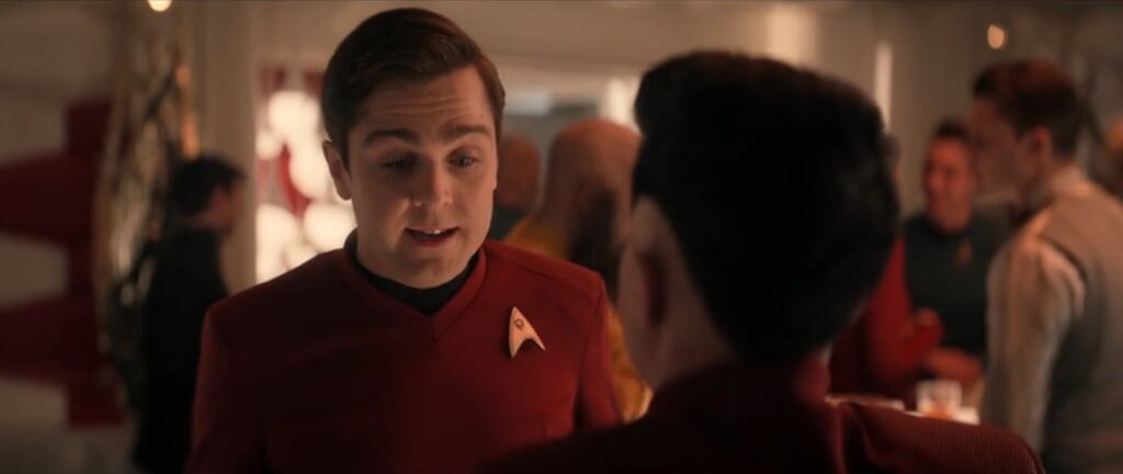 Montgomery "Scotty" Scott standing talking to Erica Ortegas who has her back to us from Star Trek: Strange New Worlds season four episode one Valles Marineris.