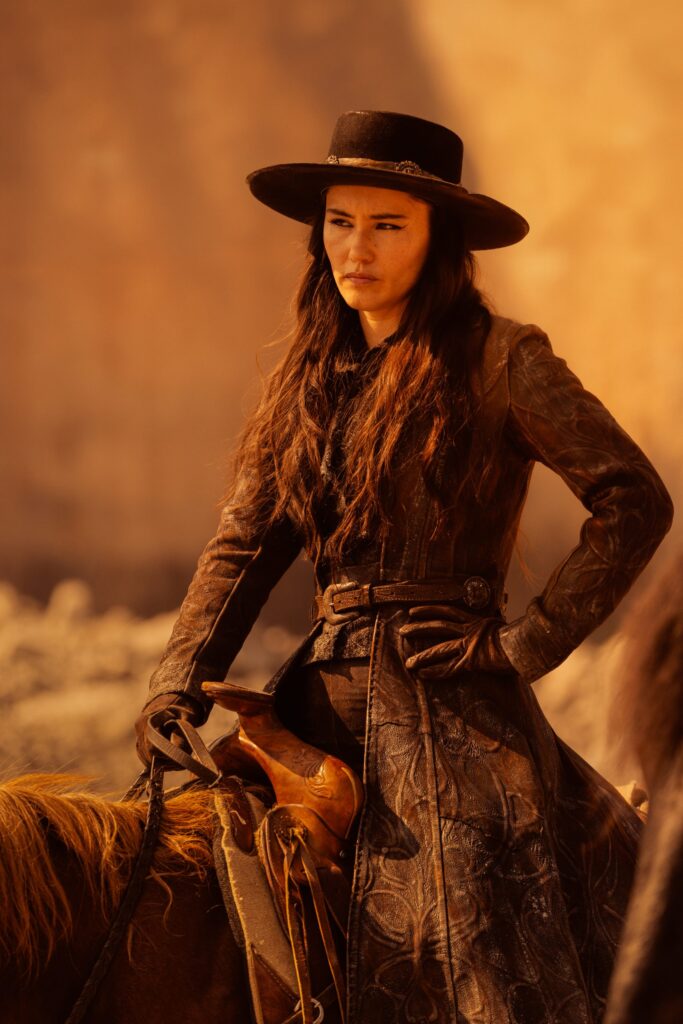 La'an Noonien-Singh straddling a horse wearing a cowboy had and long leather jacket from Star Trek: Strange New Worlds season four episode one Valles Marineris.